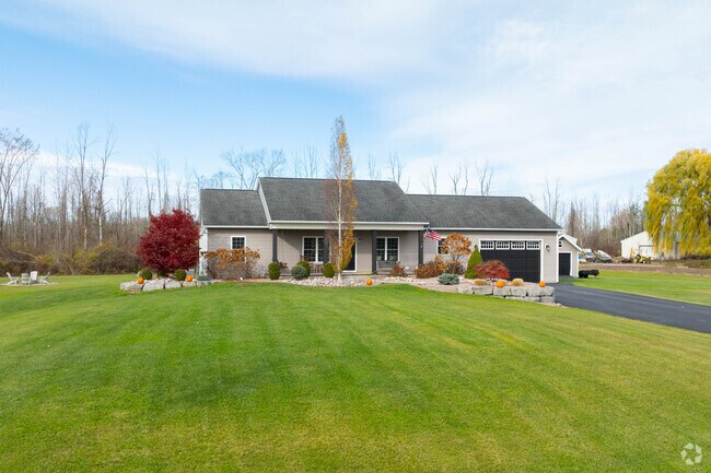 This Sullivan home features a grassy half-acre lot and quiet surroundings.