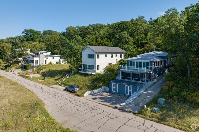 There are a variety of mixed styles homes looking out to Lake Michigan in the Dunes of Beverly Shores.