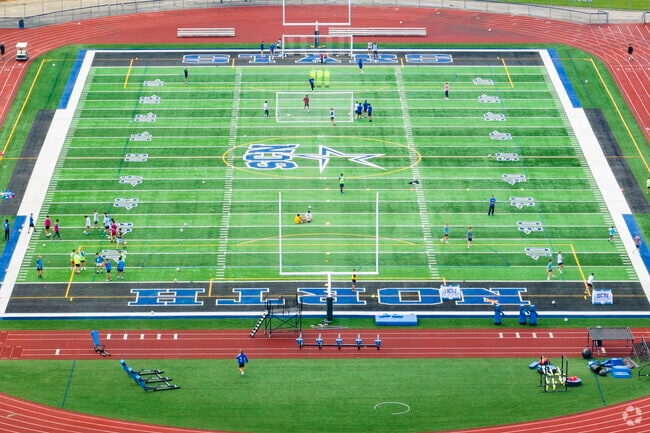 Farmington-Fox River Valley High School feaa large football field for students to play on.