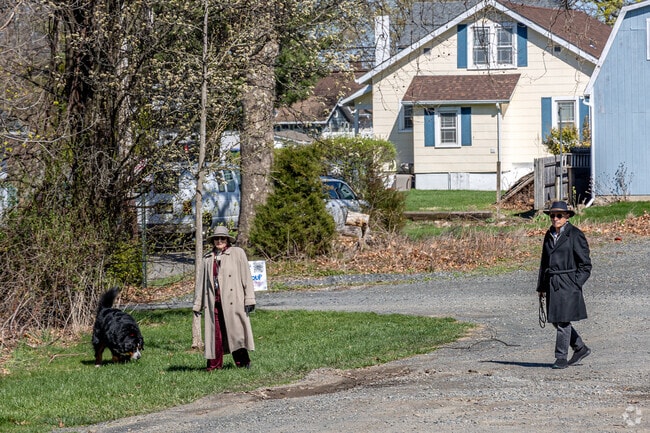 Residents enjoy walking their dogs along the quiet paths at Holjes-Sheppard Memorial Park.