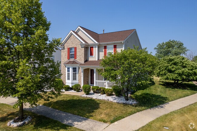 A beautiful newly built home with an outdoor patio in a new subdivision.