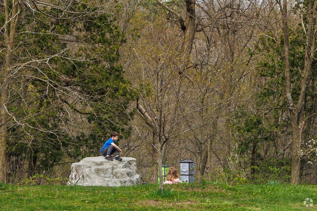 Children love to climb on the rocks at Clark Reservation State Park near Nedrow.