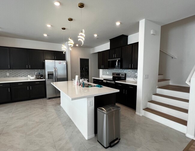 Shared kitchen with fridge, oven, stove, and more