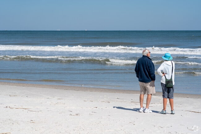 Couple enjoying the wonderful weather at Neptune Beach.