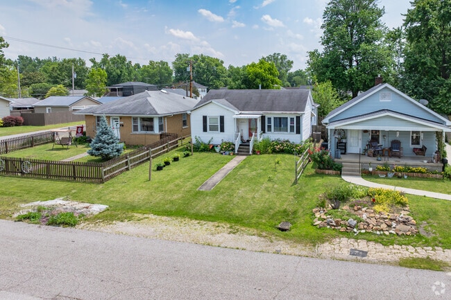 The streets in Wesselman Park are flat, with mature trees and weathered sidewalks.