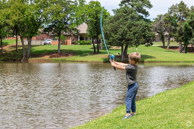 Residents pass the time fishing in one of the lakes in Cedar Valley.