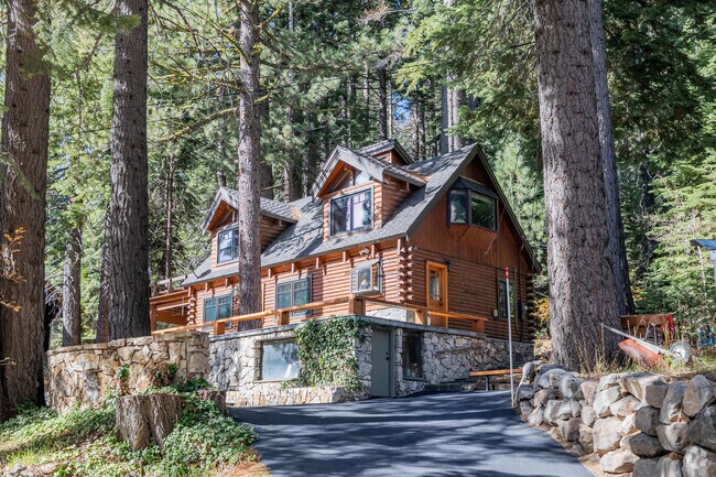 A traditional log cabin built upon the sloping mountains of Olympic Valley in Alpine Meadows.