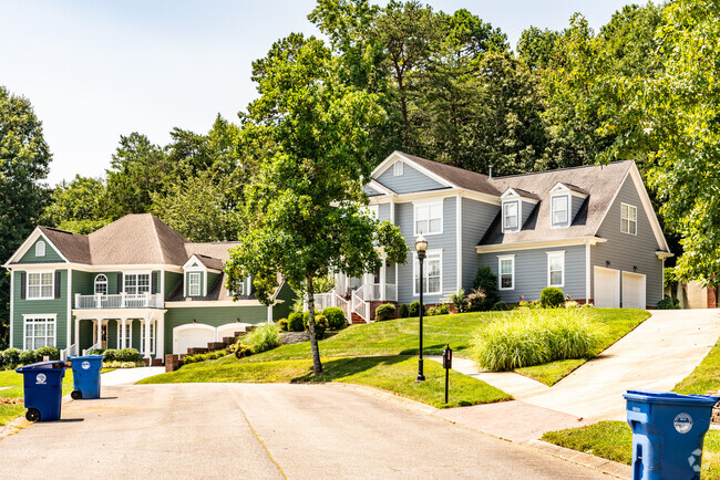 A row of two story craftsman homes in the Falling Waters neighborhood.