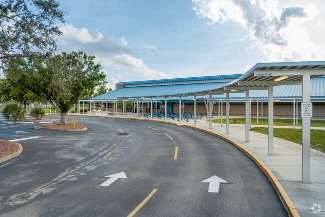 The pick up line at Three Oaks Middle School offers parents a convenient way to pick up students