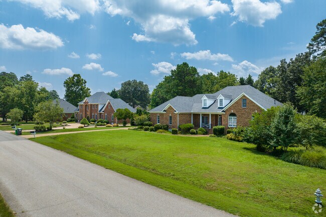 Large homes in Centralia sit on lots with manicured lawns.