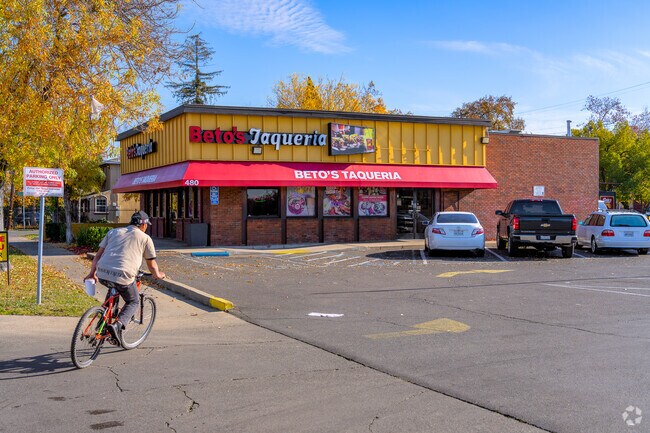 Man rides bike to Beto's Taqueria to pickup delicious food.