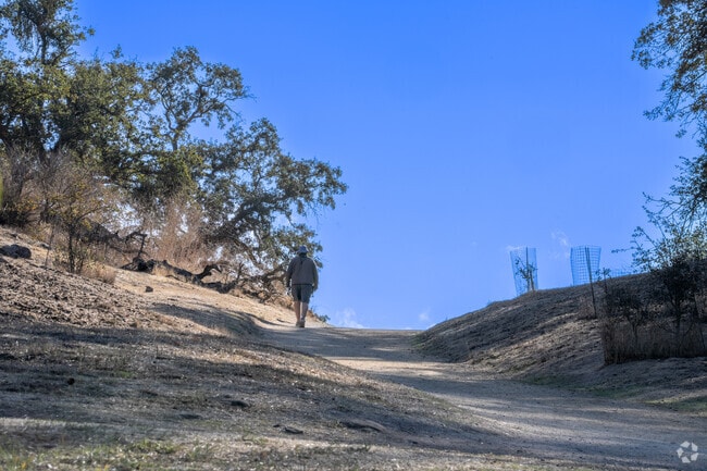 Enjoy shaded hiking trails and native oak trees at Guadalupe Oak Grove Park near Crossgate.