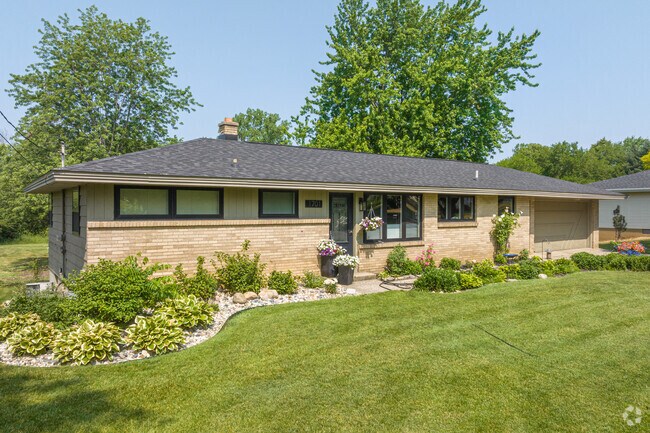 This brick-accented ranch-style home is one of many located in Holland Heights.