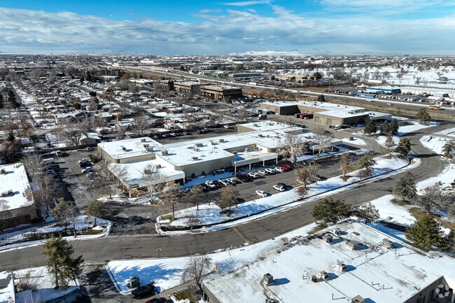 Roots Charter High School sits beneath a blue sky.