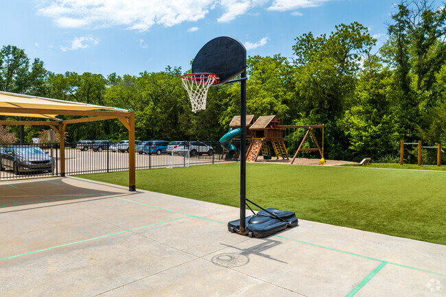 You will find a small basketball court at Branches Academy.