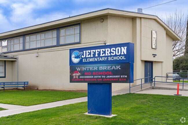 A large lighted marquee at the entrance to Jefferson Elementary School greets students.