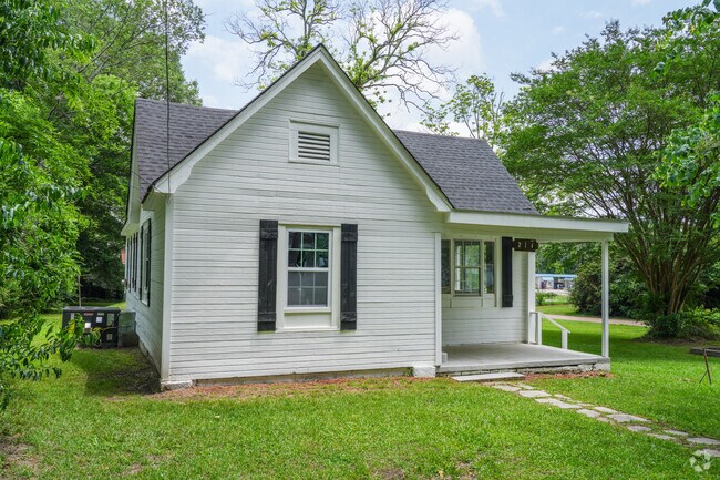 Updated Folk Victorian cottages in Willis Heights combine vintage charm with modern touches like refreshed interiors and updated fixtures.