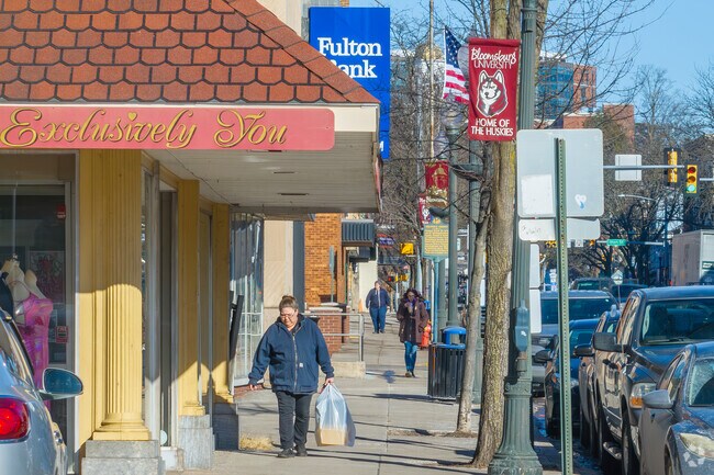 Along Bloomsburg's Main Street, locally owned shops and restaurants occupy brick storefronts in mixed-use buildings.
