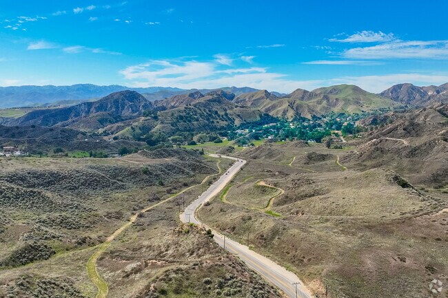 Val Verde is connected to Santa Clarita by road.