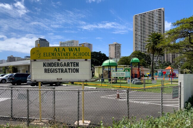 Ala Wai Elementary welcomes students and parents with a bright yellow sign.