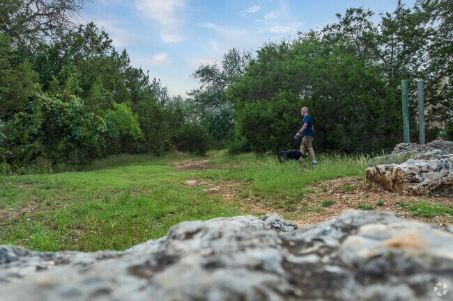 Trails with cave markers wind through the preserve near Buttercup Creek.