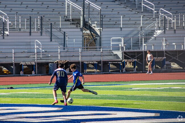 Students practice soccer at Beaumont High School Sports Stadium near Cherry Valley.