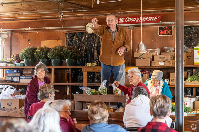 Auctioneers at the Belleville Livestock Auction sell produce, household goods and animals.