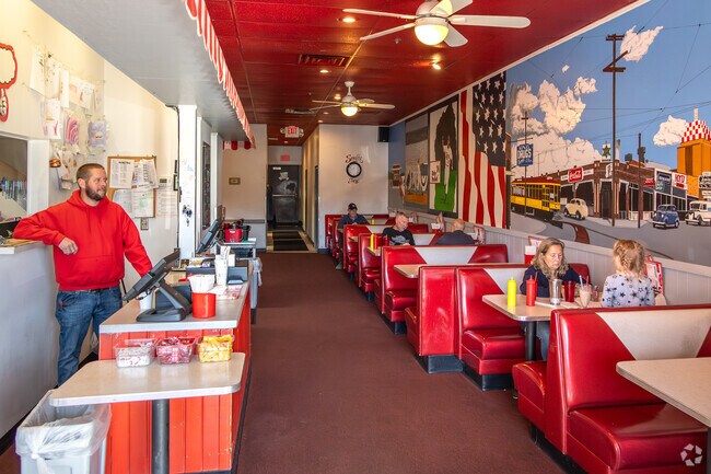 Custom artwork covers Snuffy's walls and overlooks booths near Strachauer Park.