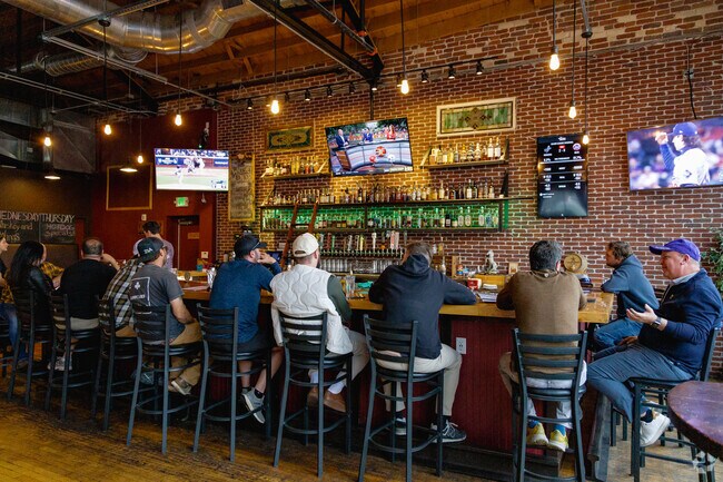 Friends gather at the Whiskey Biscuit near Baker Park for sports viewing with great beer deals.