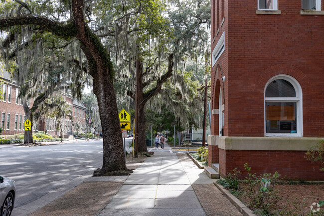 Susie King Taylor Community School is surrounded by mature trees.
