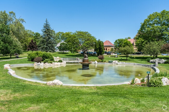 Library Park in Bath features the Spirit of the Sea statue and a peaceful pond.