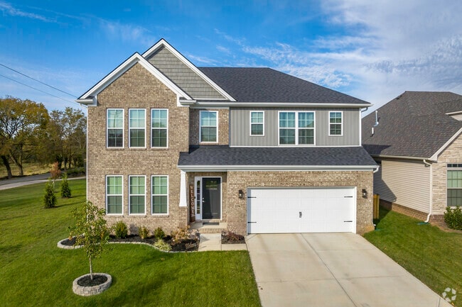 This craftsman-style two-story home has a beautiful, maintained lawn in Sandersville.