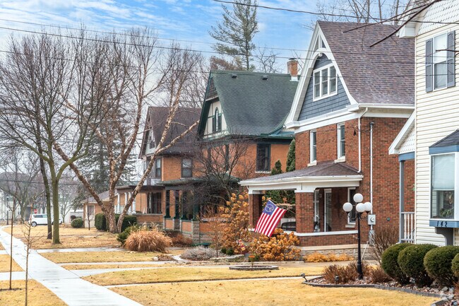 Many homes in Old Village are constructed of brick and siding with gabled roofs.