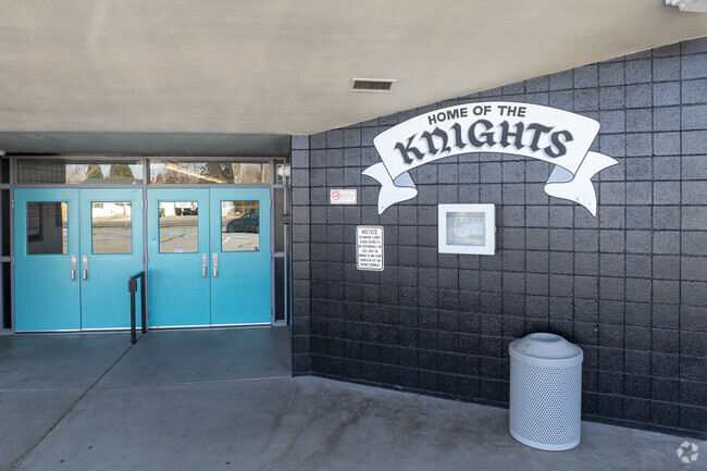 The front entrance doors and school logo at George L Dilworth Middle School.