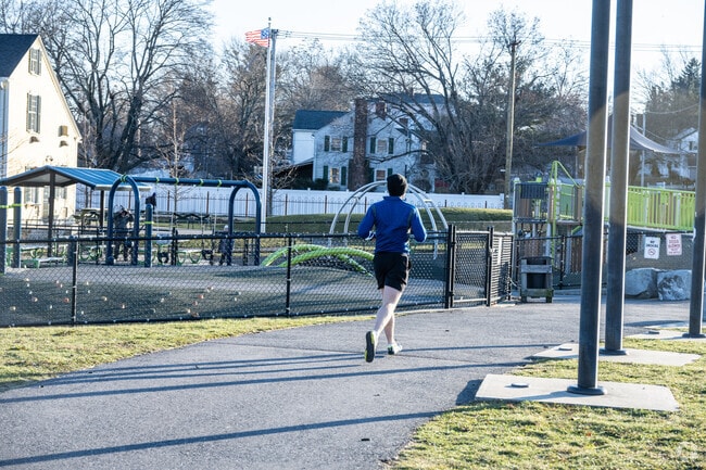 A man jogs around the Coes Reservoir in Webster Square Worcester.