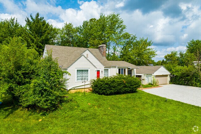 Homes in Hyde Park have long driveways and beautiful front yards.