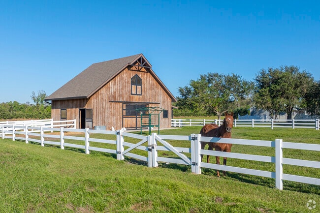 Bourg's aesthetic is rural, with barns, horses and farmland.