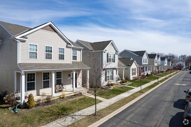 A gorgeous row of two-story new traditional style homes in the Olentangy neighborhood.