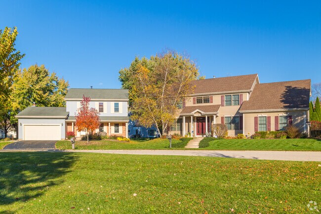 Oakwood Hills homes sometimes feature a mix of brick and wood paneling.