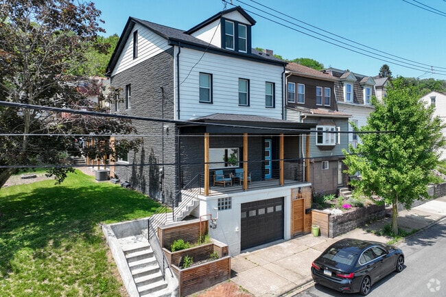 Foursquare style homes with a porch are a popular home style in the Troy Hill neighborhood.