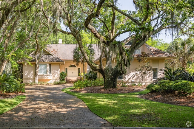 One-story homes are surrounded by vast, indigenous trees on Kiawah Island.