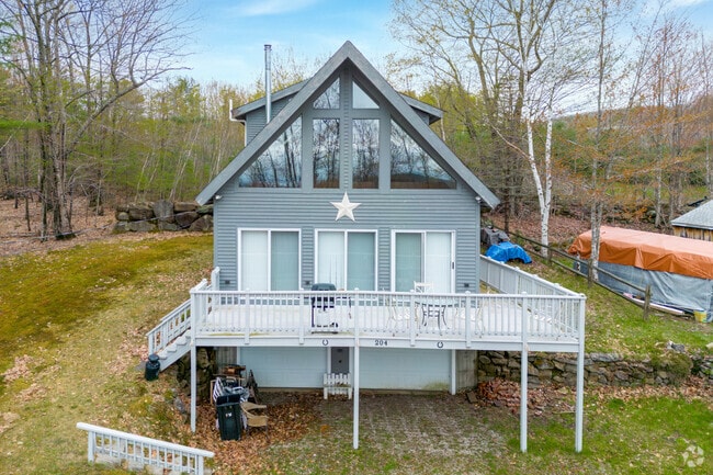 This Chalet-Style home is located in Newfield, Maine.