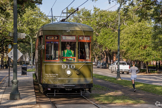 Locals jog along the St. Charles Avenue streetcar line in Central City.