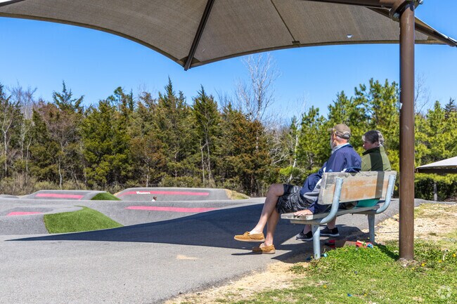 Families enjoy various activities at the Paris Sports Complex in Paris.