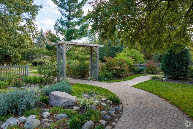 Foster Park maintains winding riverfront trails and flower beds.