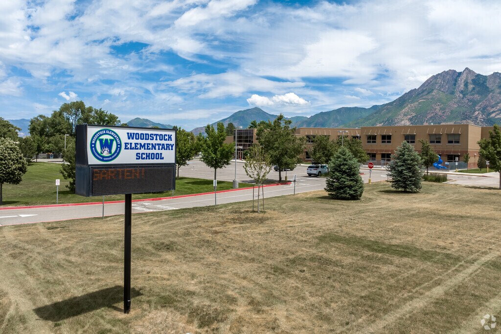 An electronic sign in the grass at Woodstock Elementary School.