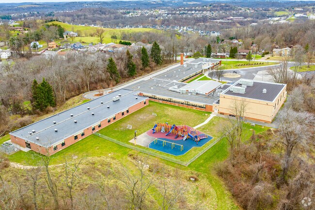 Gill Hall Elementary School is private and surrounded by forest.