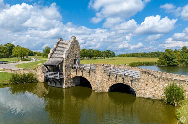 The Blount Cultural Park stone bridge is located next to the Hannah Daye Ridling Bark Park.