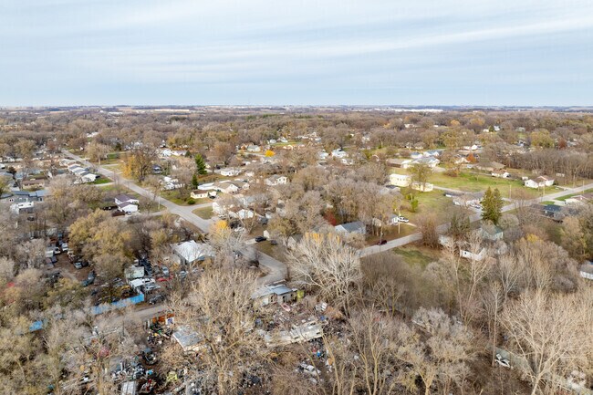 Maywood’s aerial view highlights its charm, blending homes and nature seamlessly.