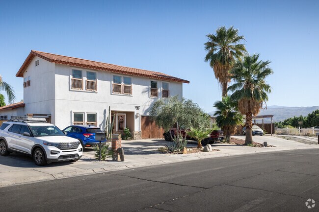 A Spanish home with shady palm trees is seen in Cathedral City.